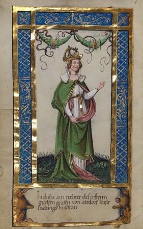 A rich, illuminated manuscript page depicting a woman, Empress Judith, crowned and standing on a patch of grass, surrounded by blue and gold borders, with a caption in German below identifying her.