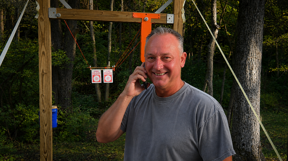 Tim talking to a customer on the phone with the Gopher Target System in the background