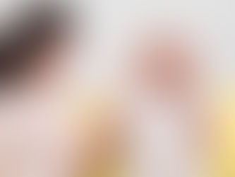 Elderly woman smiling while listening to music therapy session in dementia care home