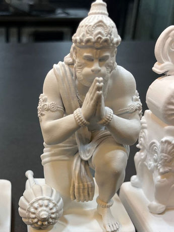 Hanuman statue in devotional pose with folded hands and detailed finish.