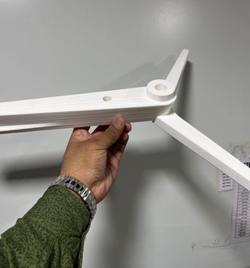 White 3D printed electronic enclosure parts.
