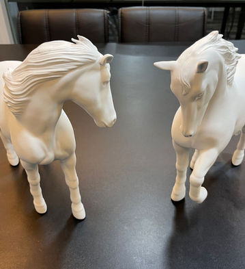 Pair of 3D printed animal figurines.