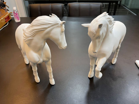 Pair of 3D printed animal figurines.