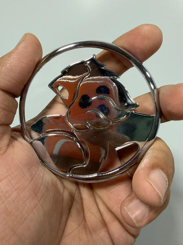 Silver plated custom part with polished surface.