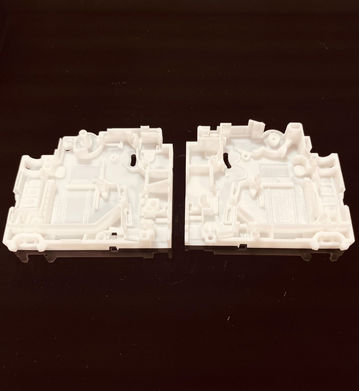 3D printed MCB component prototype in white resin.