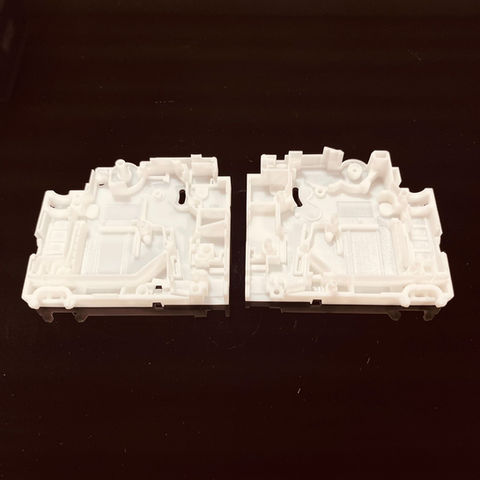 3D printed MCB component prototype in white resin.