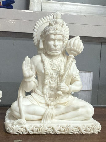 Hanuman idol with ornamental detailing and polished sculptural surface.