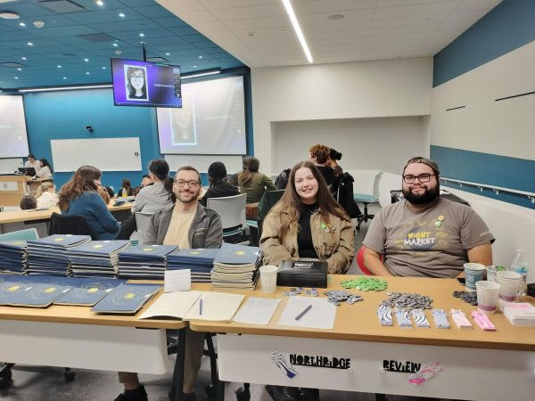 From left, Andrew Isagulyan, Saige Boddy, & Paul Herrera welcoming Northridge Review Launch Party attendees and selling copies of the Fall 2024 Edition. (Jesse Illanes)