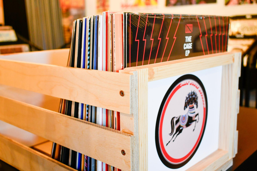 A vinyl record crate, displaying the selection available at Licorice Pizza in Studio City. AD