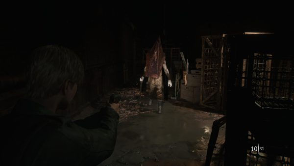 James encountering the menacing “Pyramid Head.” Captured on PS5. (Jesse Illanes)