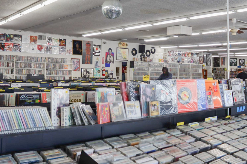 CD Trader in Tarzana demonstrating the CD aisle and wall decorations. (Madeleine Christian)