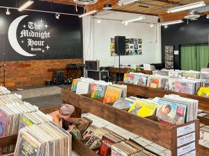 The Midnight Hour Records in San Fernando, with their record aisle in front of their stage for shows and performances. (Giuliana Melgar)