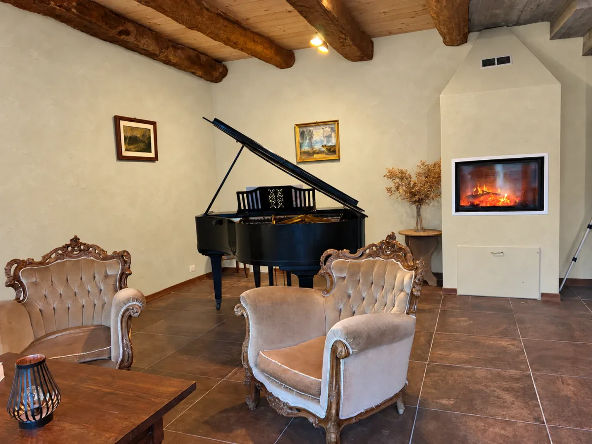 The piano and fireplace in the experience area