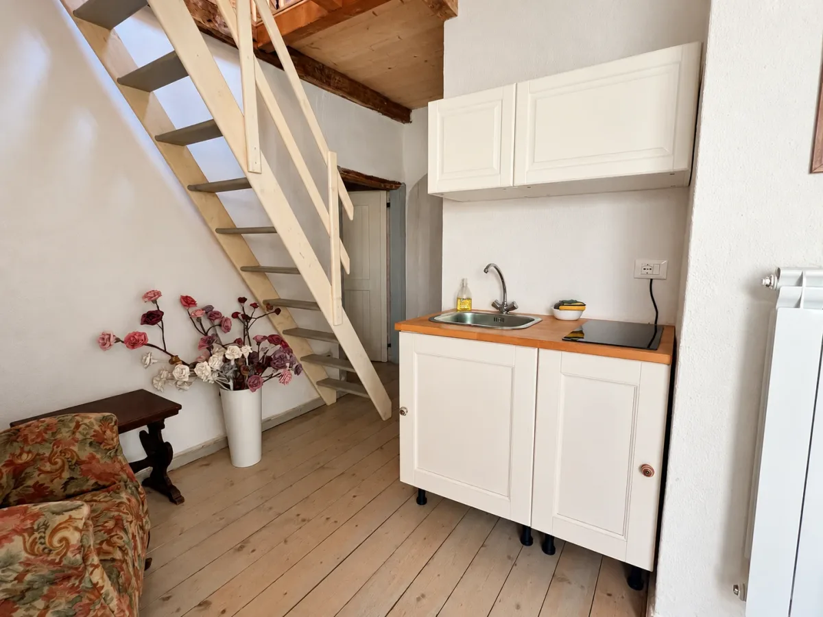 Kitchenette and stairs to the mezzanine