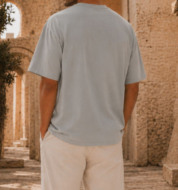 תמונה ממוזערת: Back view of The Signature Tee in Stone Grey, showing the oversized silhouette and clean PHOS styling.