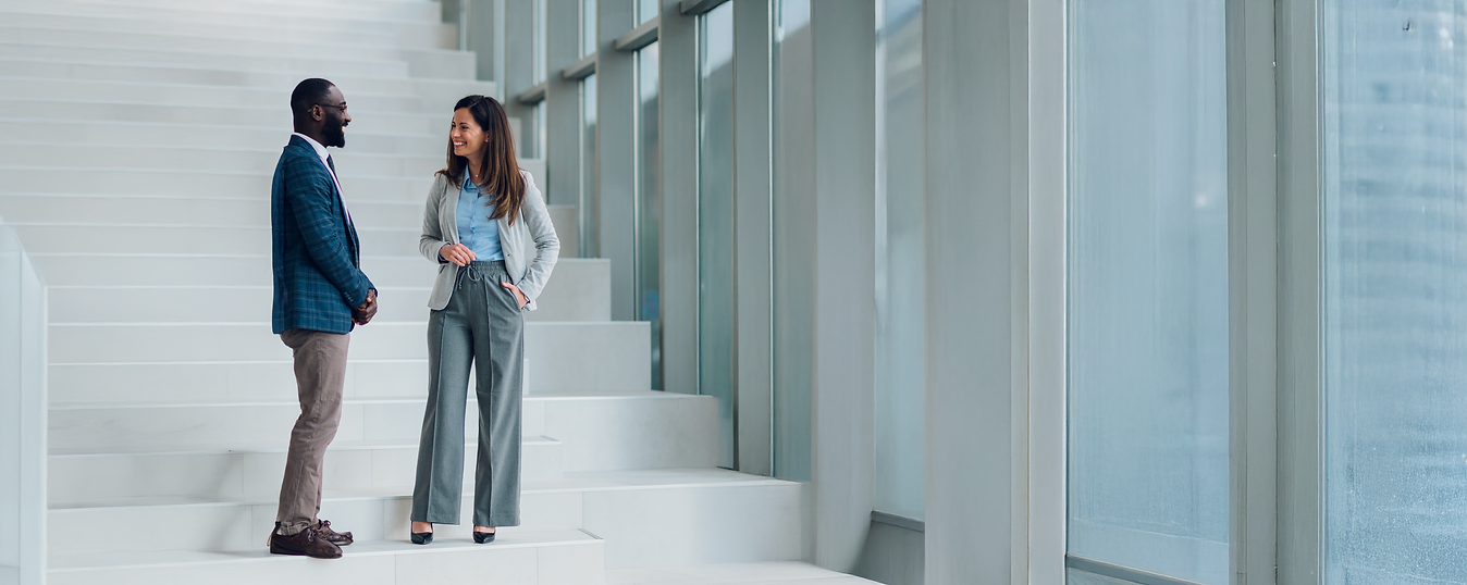 businesspeople-talking-on-stairs-in-modern-office-2025-07-01-05-35-19-utcS.png