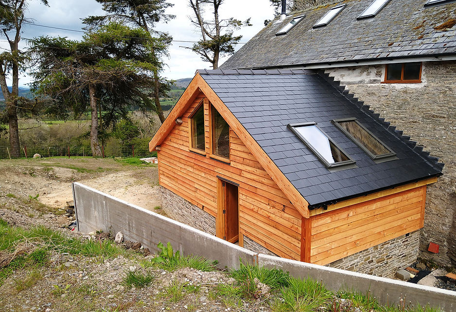 a finished timber frame extension for a house in powys, UK.