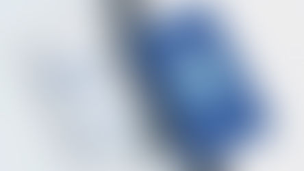 Two business cards on a light surface; one white with contact info and design services, the other blue with a cute mountain logo, "LITTLE FUJI."