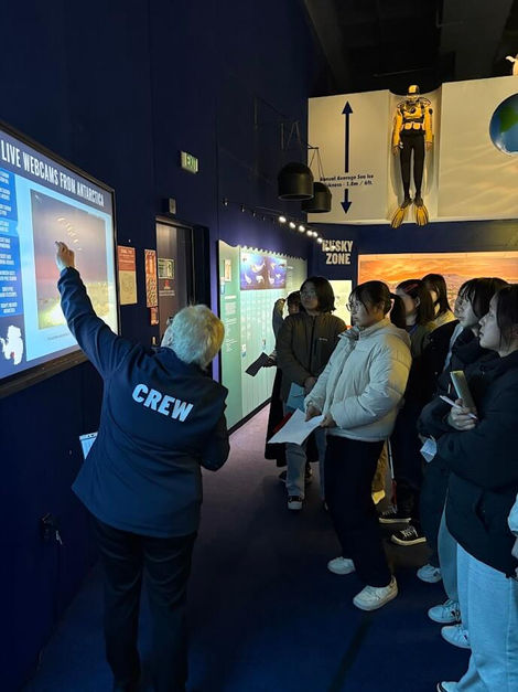 Students learning about Antarctica and environmental science through interactive exhibits at the International Antarctic Centre.