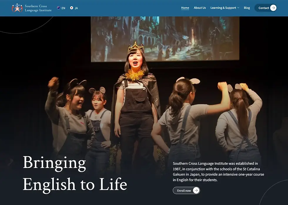 Website hero with students performing onstage; a crowned lead stands center. Text reads Bringing English to Life and Enroll now.
