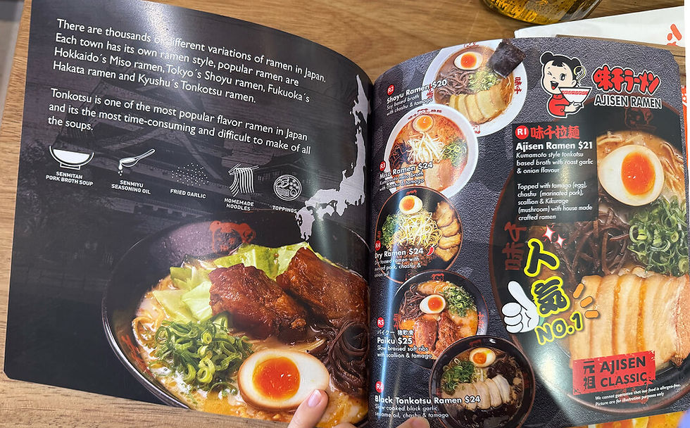 Open ramen menu with bowls, Aisen Ramen logo, prices, and Japanese/English descriptions on a dark background.