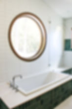 Luxury bathroom with freestanding tiled tub and tiled walk-in shower.