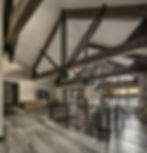 Close-up of timber beams and beautiful windows facing Priest Lake.