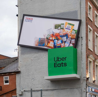 Tesco and Uber Eats drop the weekly shop from a billboard into a delivery bag