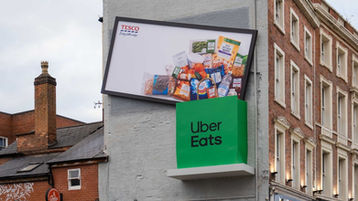 Tesco and Uber Eats drop the weekly shop from a billboard into a delivery bag