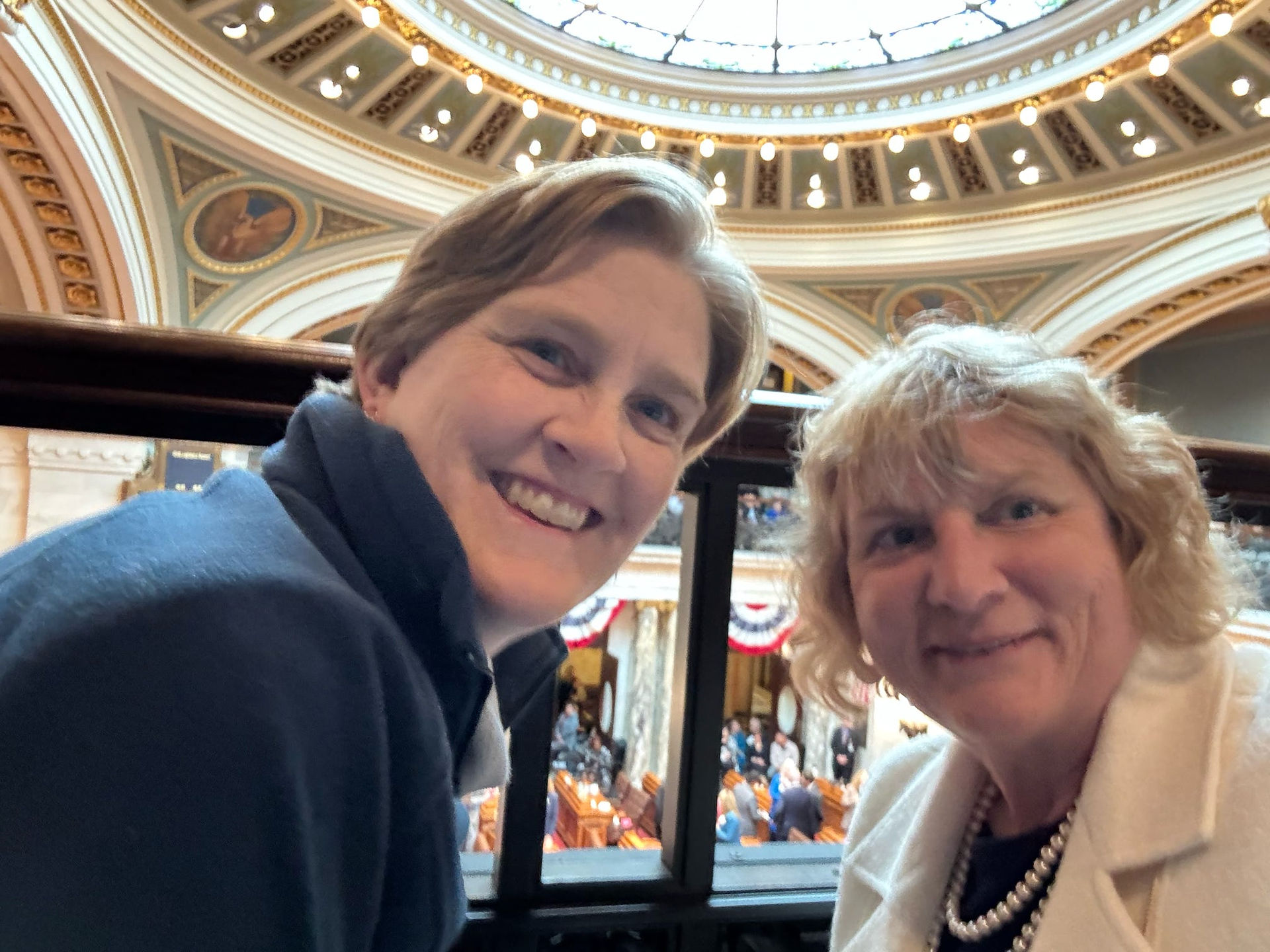 Campaign managers Jenny Rule & Sue Chandler pause for a selfie in the gallery at the Capitol.