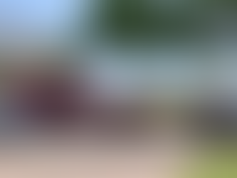 A red ambulance labeled "NASA FIRE/RESCUE", a white sedan, and a white police SUV with it's lights on are near each other in a Florida parking lot.