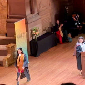 Anha crosses the stage at Richardson Auditorium.