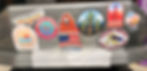 The back of a Yakima Skybox rooftop carrier with duct tape and nine stickers.