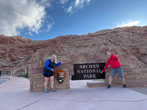 Jenny and Gina at Arches sign.