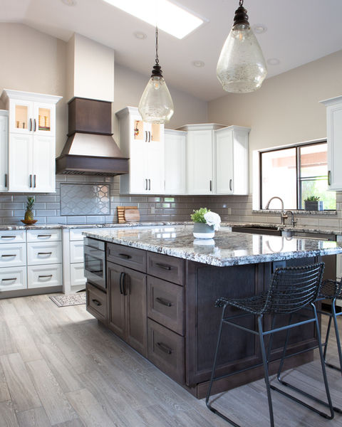 White modern kitchen, white cabinets, dark island, granite countertops, bronze hood fan, pendant lighting, Tempe