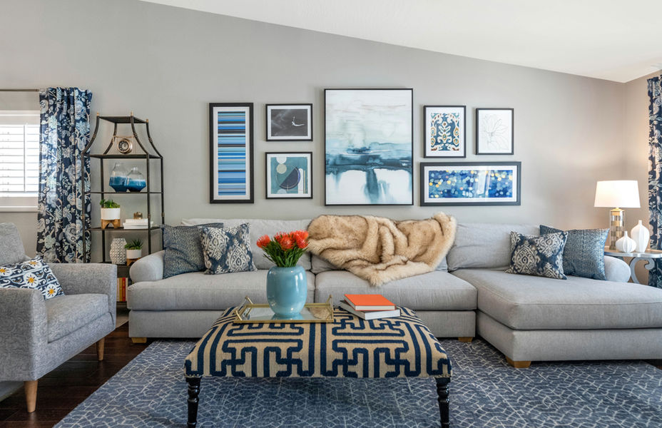Phoenix, Blue and gray family room, gallery wall, sectional sofa, fur throw, blue rug
