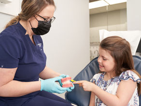 child cleaning teeth