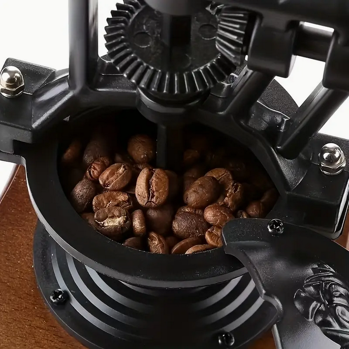 Miniaturbild: Retro Hand-Kaffeemühle mit Kurbelrad – Vintage-Design aus Gusseisen und Holz