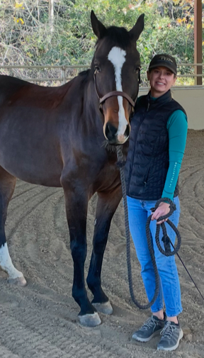 Susan standing besides mare Lady Lupita