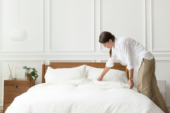 woman-making-her-bed-scandinavian-interior-style.jpg