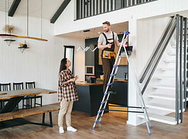 young_man_uniform_standing_ladder_room_talking_female_casualwear (1).jpg