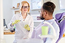 female-dentist-explaining-hygiene-rules.jpg