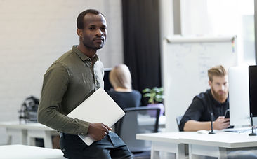 confident-successful-african-man-sitting-desk-with-laptop.jpg