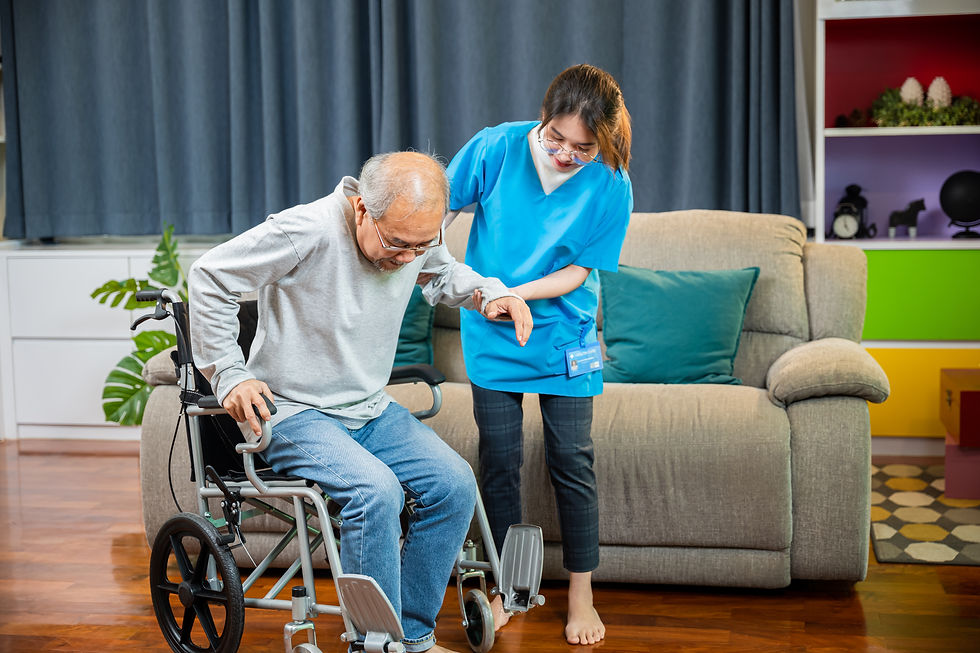 asian_nurse_assisting_helping_senior_man_patient_get_up_from_wheelchair.jpg