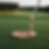 Copper golf putter resting on a green golf course