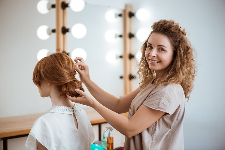 female-hairdresser-smiling-making-hairstyle-redhead-woman-beauty-salon.jpg
