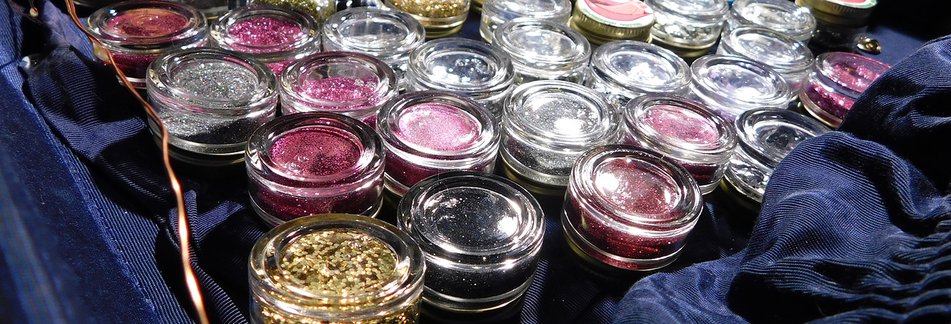 GLITLICKER eco-friendly glitter displayed in environmentally friendly cosmetic jars