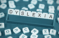Dyslexia concept with game board and ran
