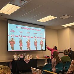 Elicia Ybarra teaching a Pretty Hands, Hard Punches women’s self defense empowerment workshop, presenting safety and awareness techniques to attendees.