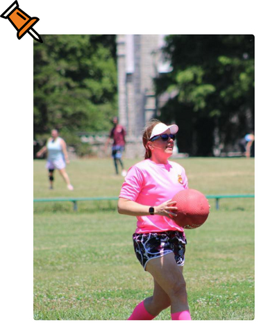 Girl getting ready to throw a kickballl